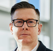 Portretfoto van directielid Alexander Hughes, CEO van een cryptohandelsbedrijf